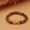 Vòng tay trầm hương mix charm Tỳ Hưu Vàng